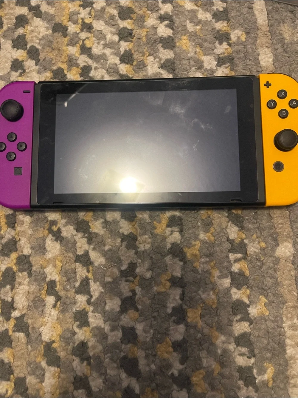 Nintendo Switch with Yellow Left Joy‑Con and Mint Right Joy‑Con